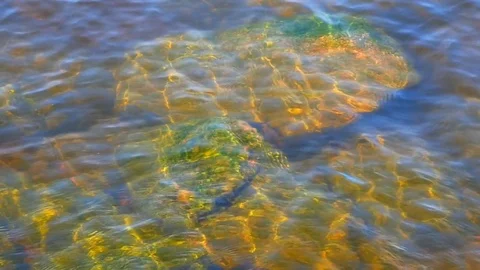 Sunlight on the stones under water Stock Footage 79739933