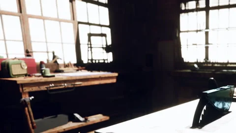 Sunlight Streaming Through Vintage Windows in a Charming Workshop Setting Stock Footage 344821507