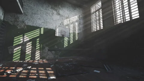 Sunlight streaming through windows in an abandoned basketball gym Stock Footage 309274221