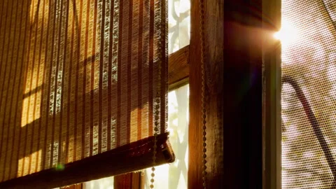 Sunlight Streams Through Bamboo Roller Blinds Inside Rustic Wooden Window Frame Stock Footage 333562853