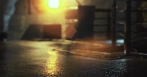 Sunlight streams through a window illuminating a rustic industrial space 스톡 일러스트
