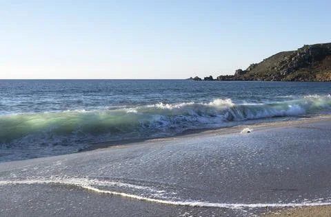 Sunlight through breaking waves Fotos Stock