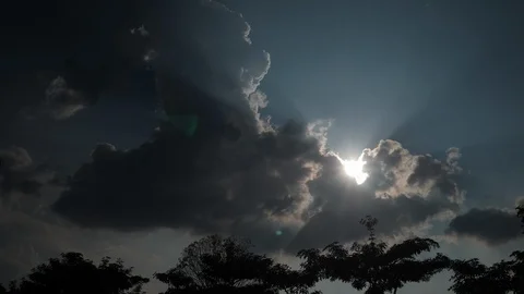 Sunlight through cloud on blue sky with truck driving Stock Footage 98236313