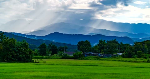 Sunlight through the clouds above the mountains in the morning. Stock Footage 288922504