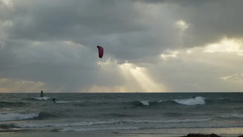 Sunlight through clouds and wind and kite surfing in Perth 6K Stock Footage 311423653