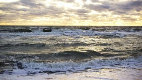 Sunlight through the clouds illuminates the sea Stock Footage 82172366