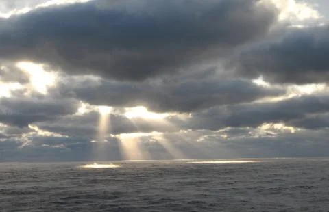 Sunlight through the clouds Stock Photos