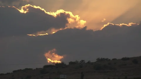 Sunlight through clouds at sunset over hilltops, Galilee, Israel Stock Footage 86759532