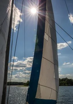 Sunlight through the sails of a sailboat Stock Photos