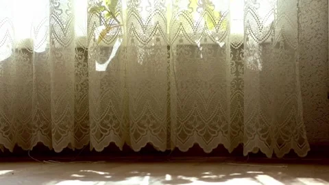 Sunlight through sheer curtains moving gently in the wind Video stock 338185512