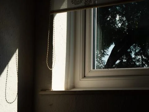 Sunlight through view of window blinds in hallway Stock Photos