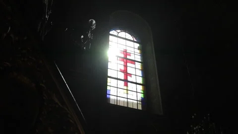 Sunlight through the window in the church. Sunlight Through Church Stain-glass Stock Footage 196003419