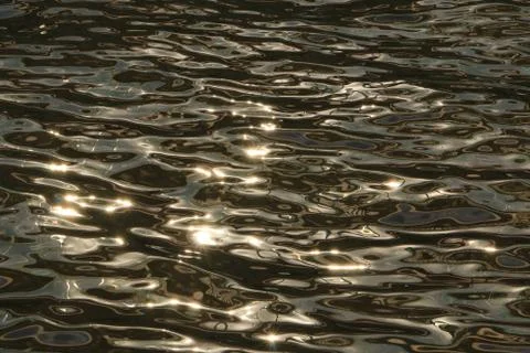 Sunlight on the unusual and beautiful patterns of water Stock Photos