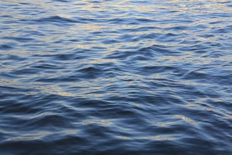 Sunlight walking through the blue waves of water Stock Photos