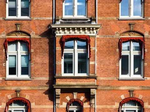 Sunlight on the windows of an old office building Stock Photos