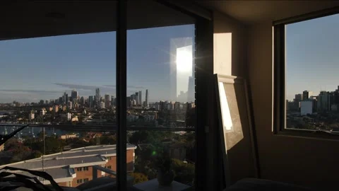 Sunligtht reflected in a mirror and Window view of  Sydney cityscape dolly Stock Footage 246834304