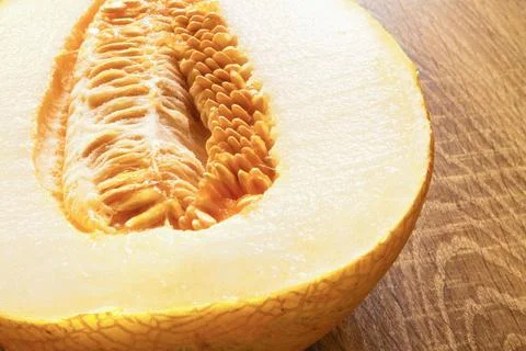 Sunlit Amal melon on the table close-up Stock Photos