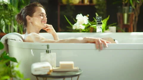 Sunlit Bubble Bath for Rejuvenating Self-Care Stock Footage 318934219
