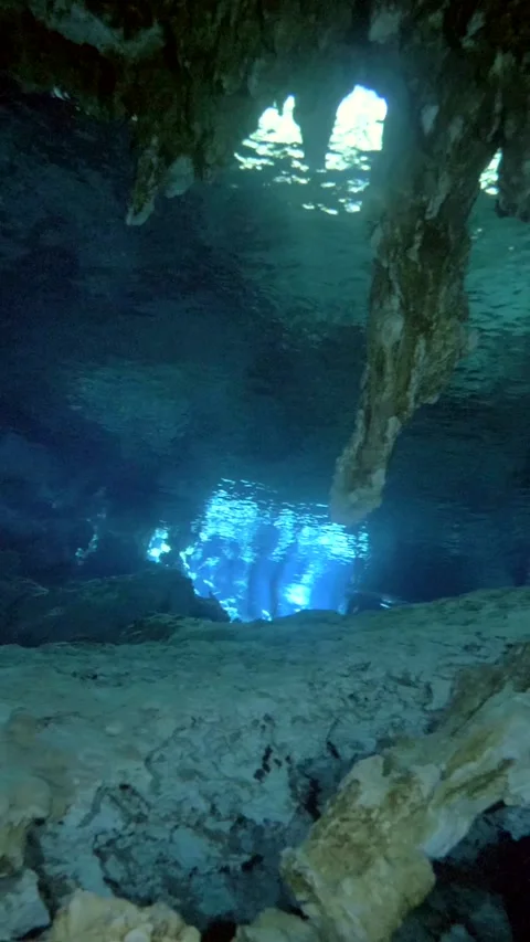 Sunlit cavern opening above a pale rocky floor Stock Footage 341361698