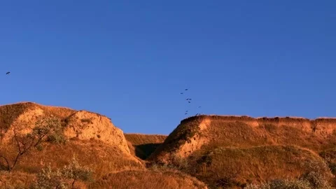 Sunlit Clay Slopes and Soil Erosion Formations Stock-Footage 344818211