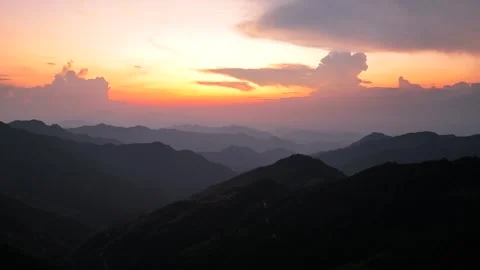 Sunlit Cloud Edges Above Mountain Summit Golden Rim 4K Aerial Stock Footage 320329310