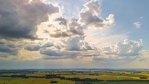 Sunlit Clouds Casting Shadows Over Farmland Stock Footage 326286589