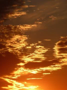 Sunlit clouds Stock Photos