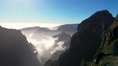 Sunlit Clouds Rolling Over Mountainous Valley in Madeira Stock Footage 334534353