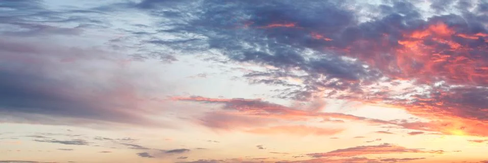 Sunlit clouds in summer sky Stock Photos