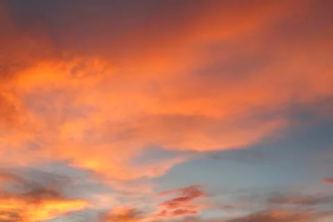 Sunlit clouds in summer sky Stock Photos