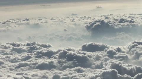 Sunlit Cloudscape Creating a Sea of Fluffy Formations in the Sky Stock Footage 336476557