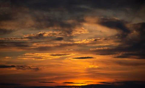 Sunlit cloudy sky. Sunset Stock Photos