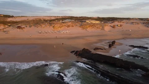 Sunlit coastal scene, beach during warm golden hour Stock Footage 345499754