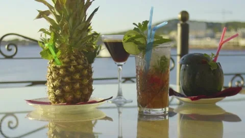Sunlit cokctials on a table Video stock 140056404