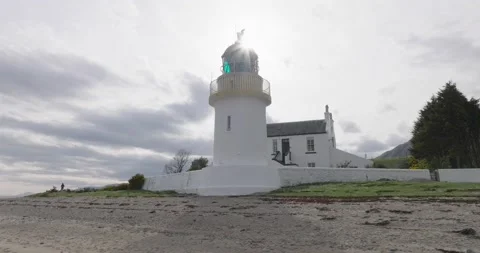 Sunlit Corran Point Lighthouse: Aerial Loop with Stunning Flare Effect Stock-Footage 239777771