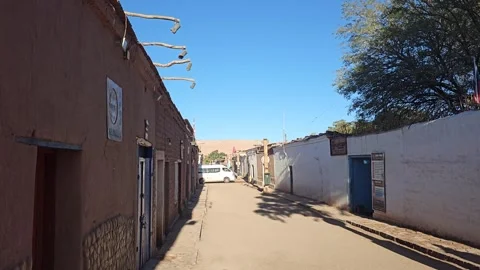 Sunlit Dirt Street between Adobe Houses, San Pedro de Atacama, Chile 8K Stock-Footage 331537452