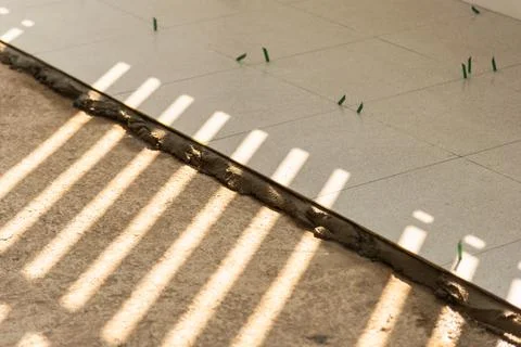 Sunlit diy floor installation process close-up of home interior construction Stock Photos