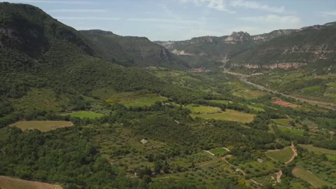 Sunlit drone view of the Terrasses du Larzac hills and valleys 動画素材 332708598