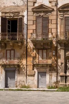 Sunlit Facade with Rustic Balconies Stock-Fotos