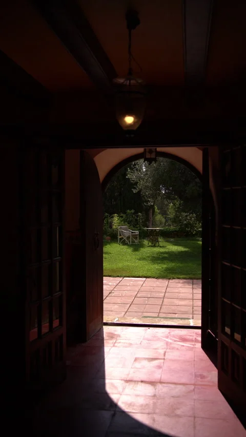 Sunlit Garden Opens Beyond Dark Farmhouse Entrance Hallway Stock Footage 343907222