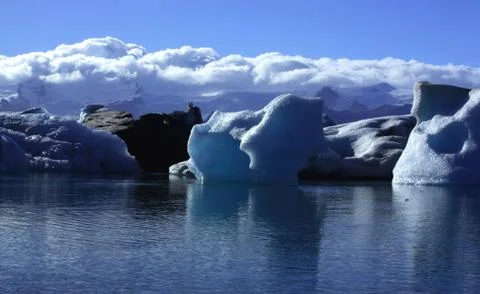 Sunlit icebergs Stock Photos