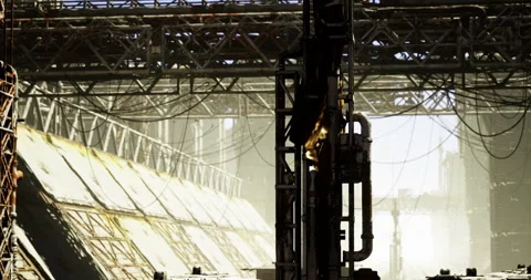 Sunlit industrial landscape with complex structures and cables Stock Footage 317778384