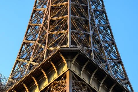 Sunlit iron lattice of Eiffel Tower close-up Stock Photos
