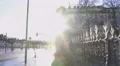 Sunlit lion monument in Geneva, traffic in street, spring time in Switzerland 4k or 4k+ Resolution