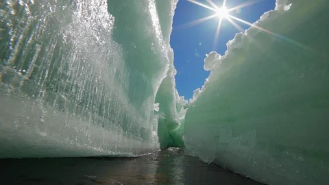 Sunlit melting ice crack in the spring Stock Footage 91155047