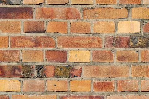 Sunlit Mixed Brick Wall 스톡 사진