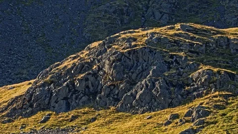 Sunlit mountain outcrop. Stock Footage 118386989