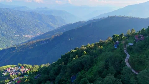 Sunlit Mountain Slopes and Winding Country Path Stock Footage 340278610