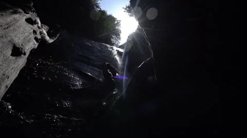 Sunlit Mountain Waterfall Sparkling in the Light Stock Footage 313355734