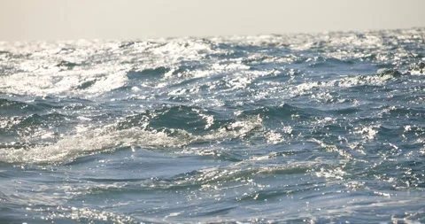 Sunlit Ocean Waves Sparkling in Warm Light Stock Footage 341640352